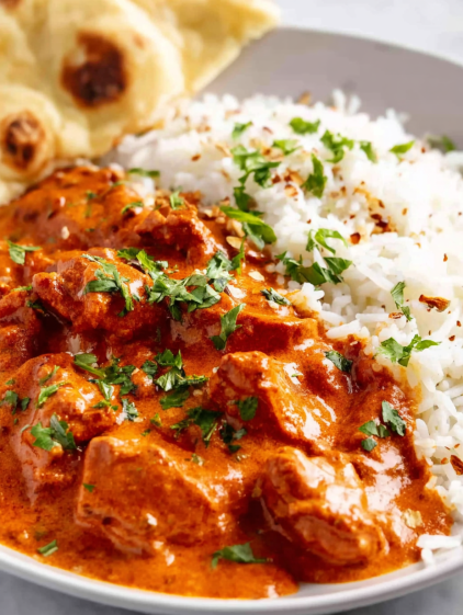 A plate of food with rice and meat.