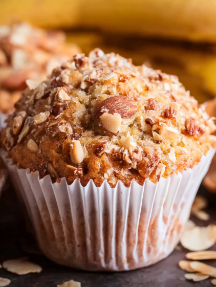A muffin with nuts and bananas.