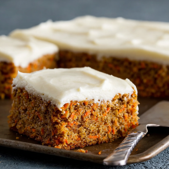 A slice of carrot cake on a plate.