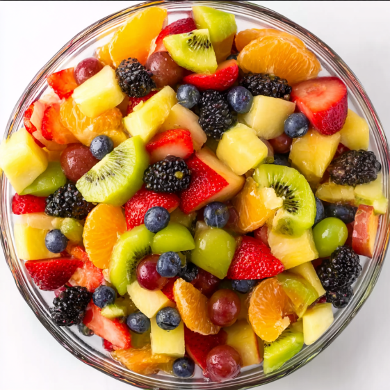 A bowl of fruit salad with kiwi, strawberries, blueberries, and oranges.