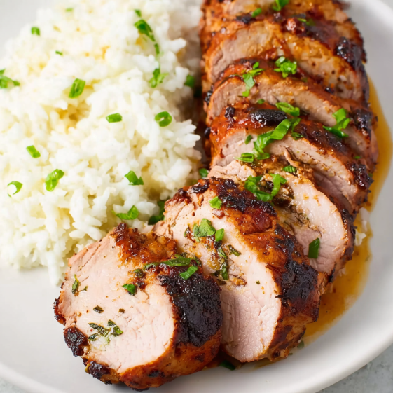 A piece of meat on a plate.