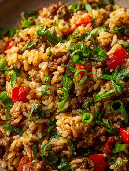 A close up of a dish of dirty rice.