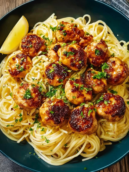 A bowl of delicious lemon parmesan pasta with chicken.