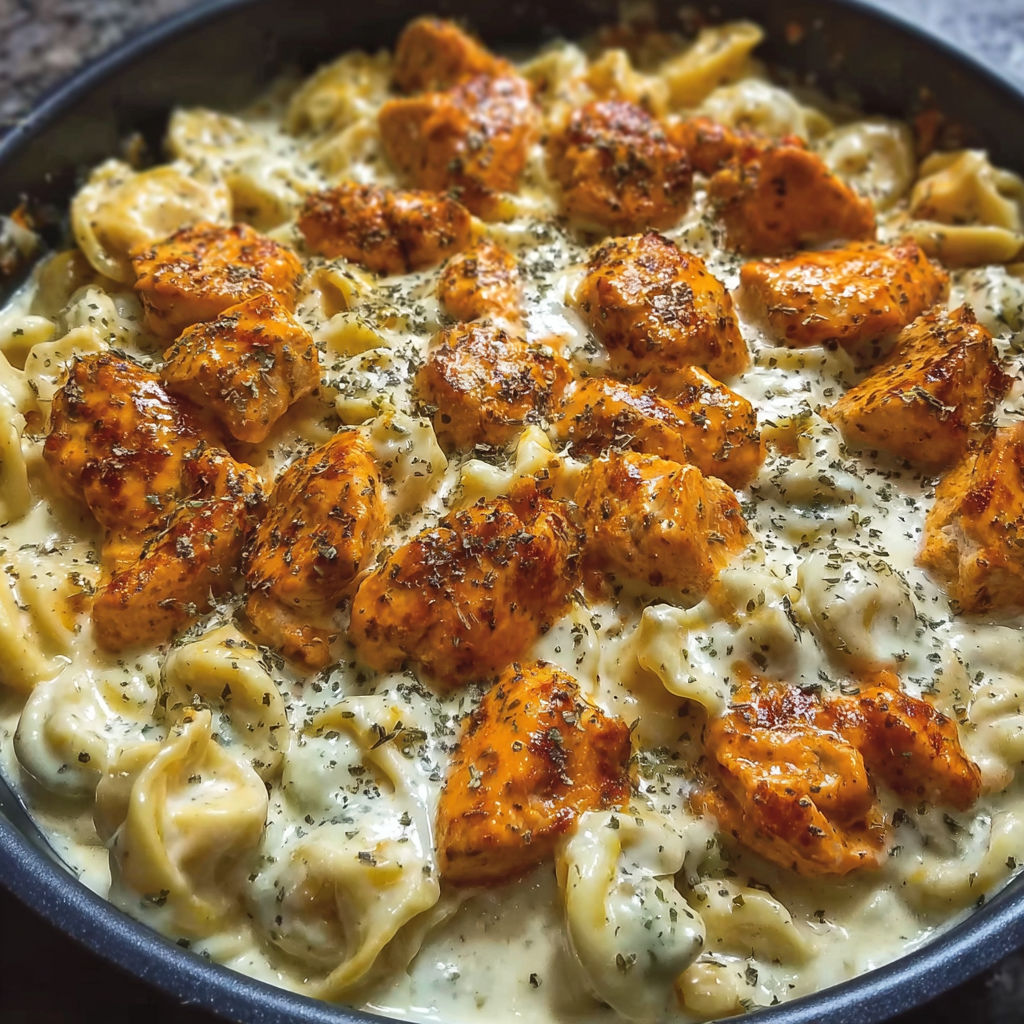 A dish of buffalo chicken tortellini alfredo.