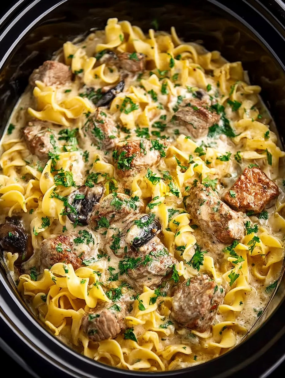 A close up of a crock pot beef stroganoff.