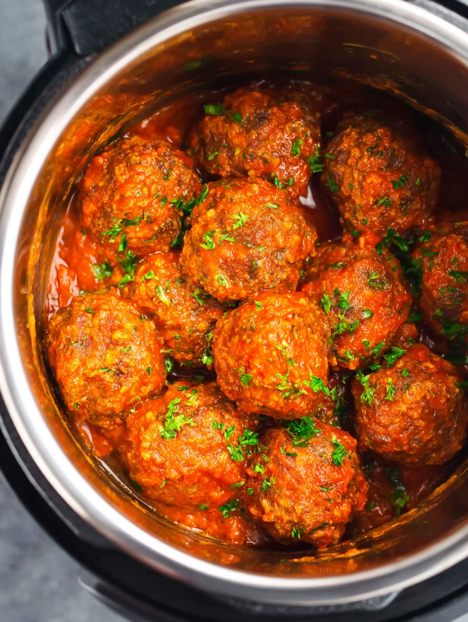 A pot of meatballs in a tomato sauce.