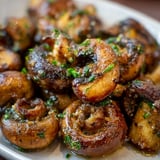 A plate of garlic butter mushrooms.