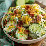 A bowl of cucumber ranch crack salad.