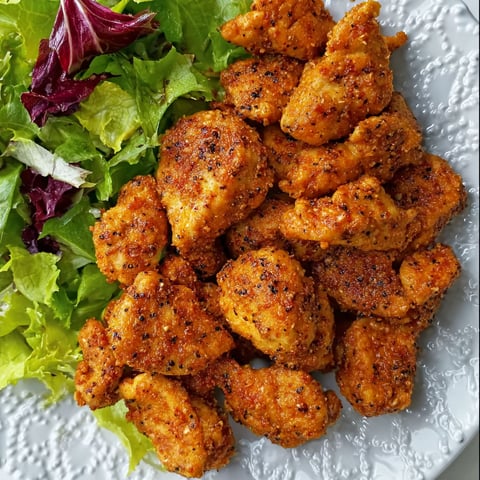 A plate of chicken bites with a brown sugar mustard rub.