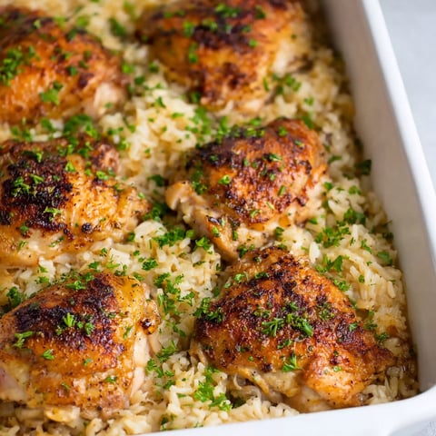 A dish of baked chicken and rice.